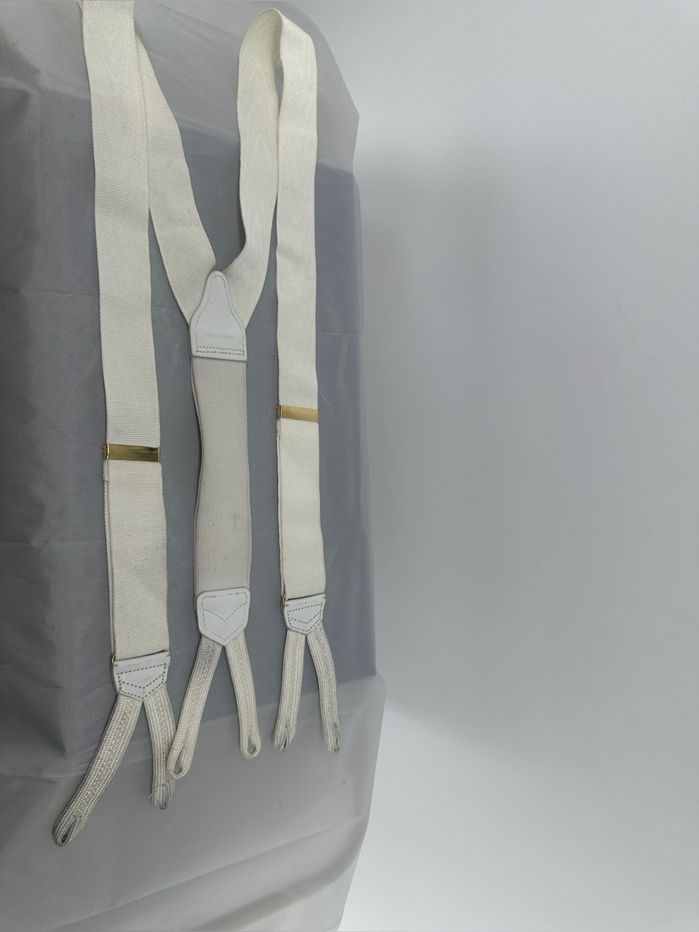 All white vintage made in England suspenders
